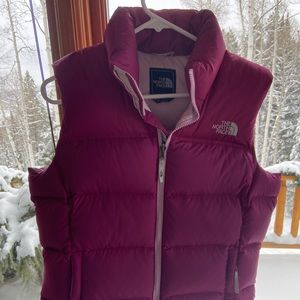 The North Face Magenta zip-up vest.